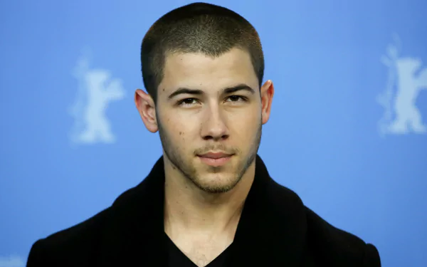 HD desktop wallpaper and background featuring a poised man in a black shirt.