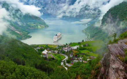 A breathtaking view of a Norwegian fjord, featuring a cruise ship on the water, surrounded by misty mountains, lush forests, and a quaint village nestled in the landscape.