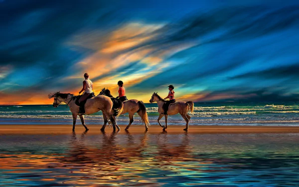 A serene sunset beach scene features three horse riders walking along the shore, capturing the beauty of nature in this stunning HD desktop wallpaper.