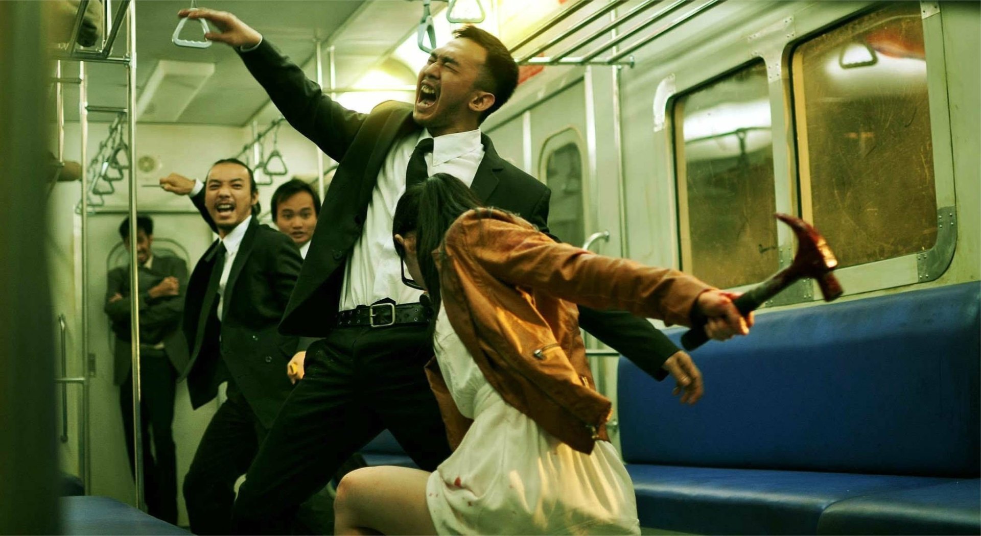 HD PC desktop wallpaper featuring an intense fight scene from the movie The Raid 2 inside a subway train.