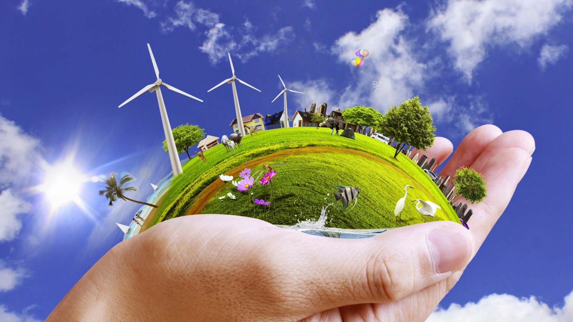 HD desktop wallpaper showing a small green planet with wind turbines, trees, animals, and flowers held gently in human hands, celebrating Earth Day and environmental care.
