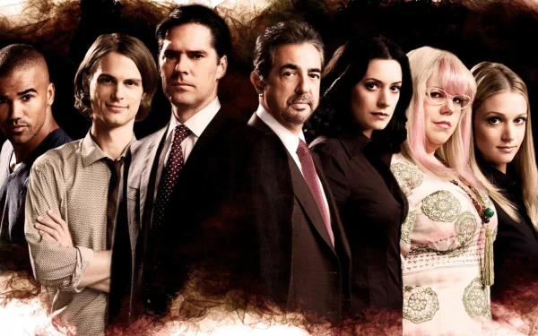 An HD desktop wallpaper showcasing the main cast of the TV show Criminal Minds, featuring the team lined up against a dramatic backdrop.