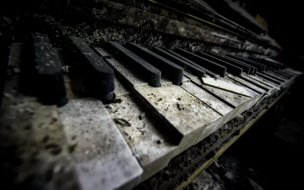 Macro shot of an old, dusty piano keyboard, highlighting the worn keys and texture in 4K Ultra HD quality for a music-themed PC desktop background.