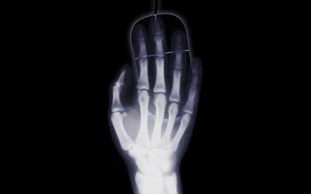 A minimalist X-ray image of a hand grasping a black computer mouse, combining elements of humor and photography in stunning 8K Ultra HD.
