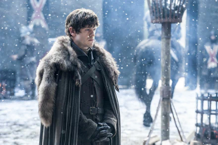 Ramsay Bolton, portrayed by Iwan Rheon, stands in the snow, clad in a fur-lined cloak, set against the dramatic backdrop of Game of Thrones in this 4K Ultra HD desktop wallpaper.