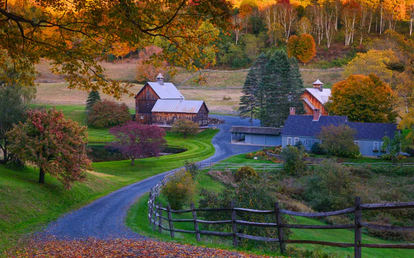 A serene fall farm scene with colorful trees, a winding street, a barn, and a house, captured in HD for a PC desktop wallpaper background.