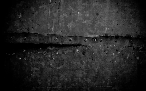 Abstract grunge monochrome concrete texture with scratches and rivets — 5K Ultra HD PC desktop wallpaper background.
