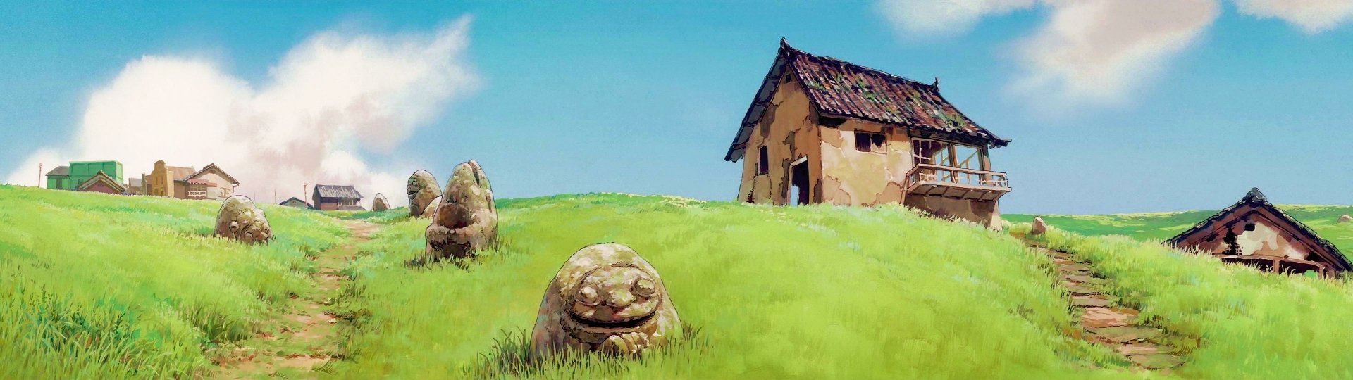 HD PC desktop wallpaper featuring a serene anime scene from Spirited Away, with a quaint house on a grassy hill under a bright blue sky.
