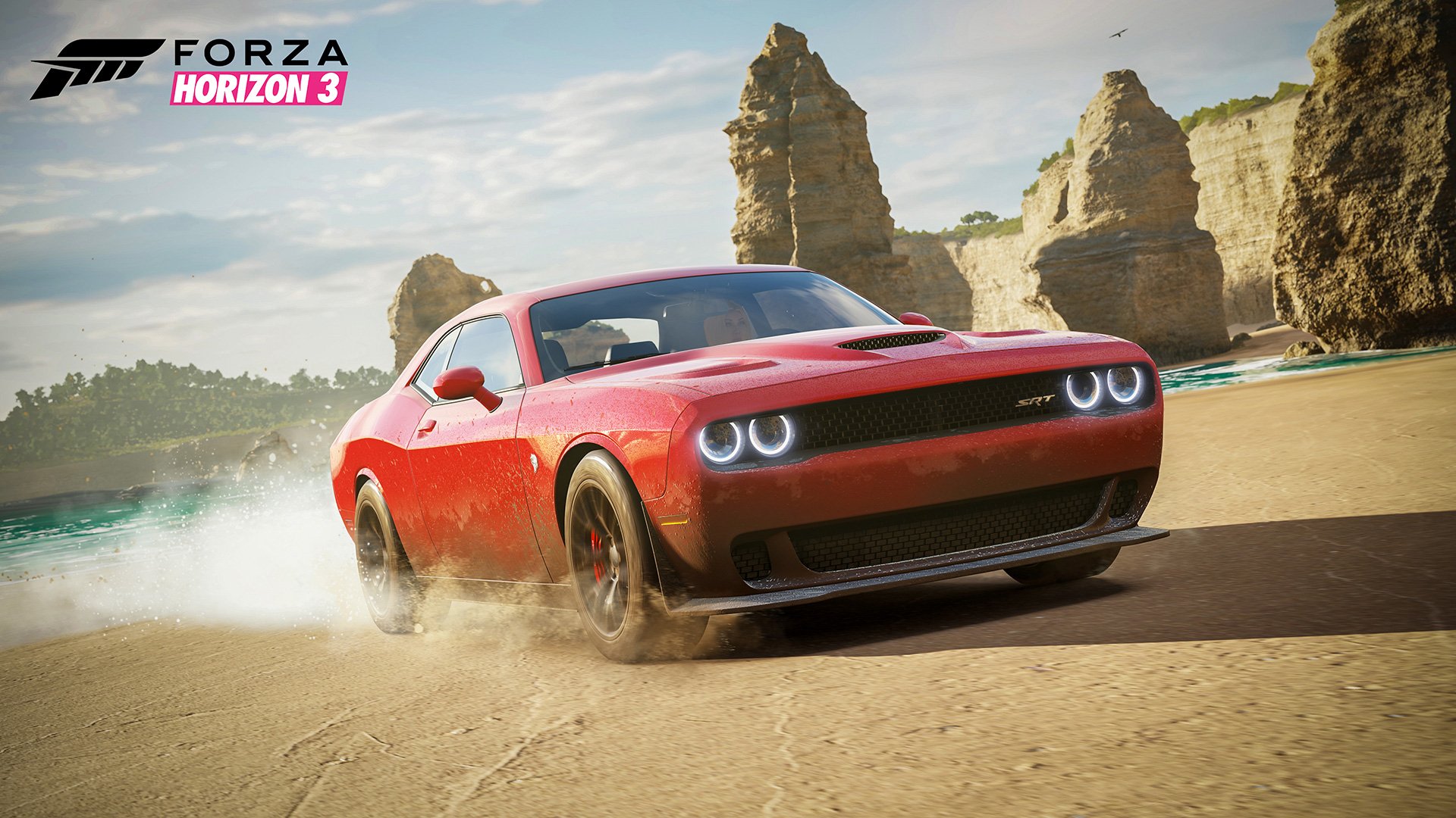 A vibrant red car speeds along a sandy beach, kicking up dust, with rocky cliffs in the background. This HD wallpaper features artwork from the video game Forza Horizon 3.