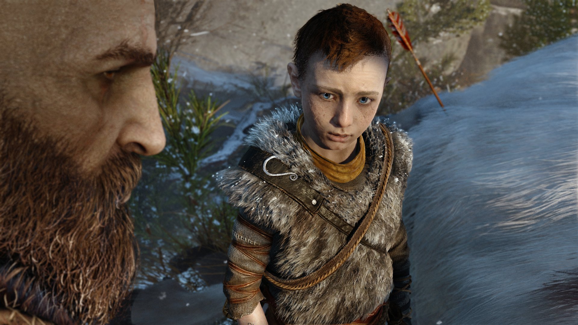 HD desktop wallpaper featuring Kratos and Atreus from the video game God of War (2018). The image captures a close-up of the characters in a snowy outdoor setting.