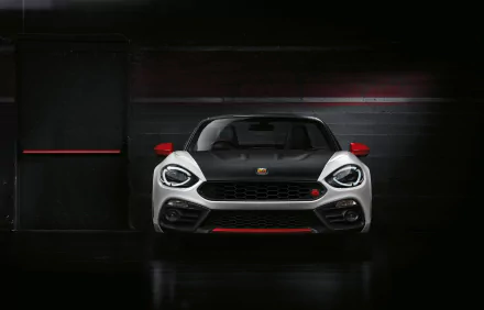 Front view of a white Fiat 124 Spider vehicle with red accents in a dark garage — high-contrast 4K Ultra HD PC desktop wallpaper/background.
