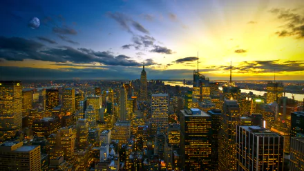 HD PC desktop wallpaper showing Manhattan’s city skyline at dusk with glowing buildings under a vibrant sky, capturing the man-made beauty of New York.