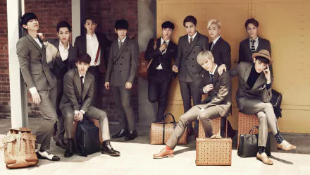 HD desktop wallpaper featuring the members of Exo in stylish suits posed in a vintage setting.