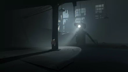HD desktop wallpaper of 'Inside' the video game showing a boy in a dark, atmospheric industrial setting with a spotlight in the background.