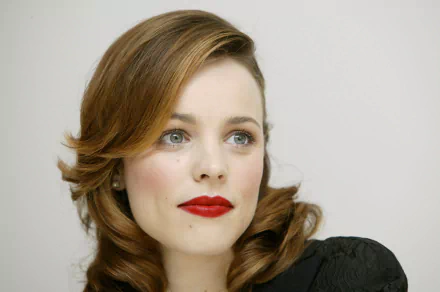 Close-up portrait of Canadian actress Rachel McAdams with brunette hair and red lipstick, captured in 4K Ultra HD quality for a PC desktop wallpaper.