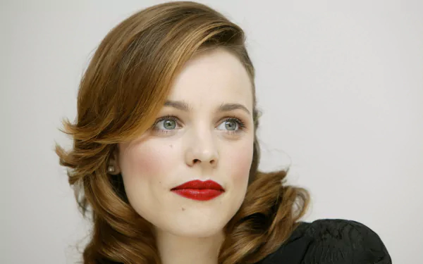 Close-up portrait of Canadian actress Rachel McAdams with brunette hair and red lipstick, captured in 4K Ultra HD quality for a PC desktop wallpaper.