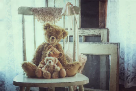 A group of stuffed teddy bears arranged on a vintage chair in soft, natural light, creating a cozy and nostalgic HD desktop wallpaper background.
