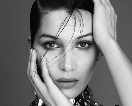 Black and white close-up portrait of brunette American model and celebrity Bella Hadid, featured as a high-definition PC desktop wallpaper and background.