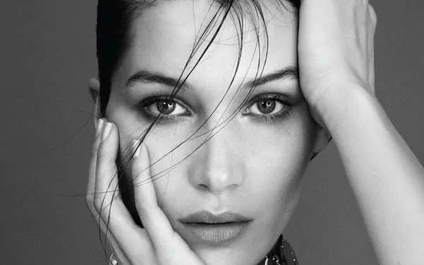 Black and white close-up portrait of brunette American model and celebrity Bella Hadid, featured as a high-definition PC desktop wallpaper and background.