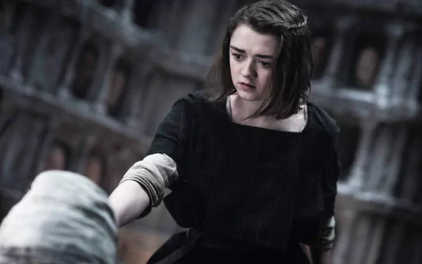 Maisie Williams as Arya Stark in a dramatic scene from Game of Thrones, captured in vibrant 4K Ultra HD for a striking desktop wallpaper and background.