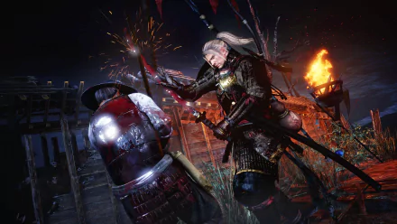 HD PC desktop wallpaper from the video game Nioh, depicting an intense samurai battle scene with dynamic lighting and fiery effects at night.