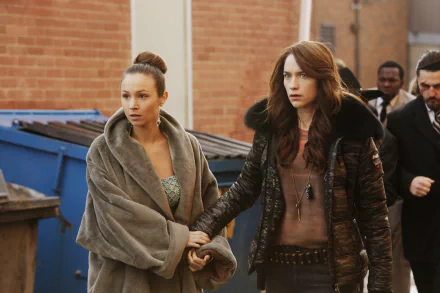 HD desktop wallpaper featuring Dominique Provost-Chalkley as Waverly Earp and Melanie Scrofano in a scene from the TV show Wynonna Earp.