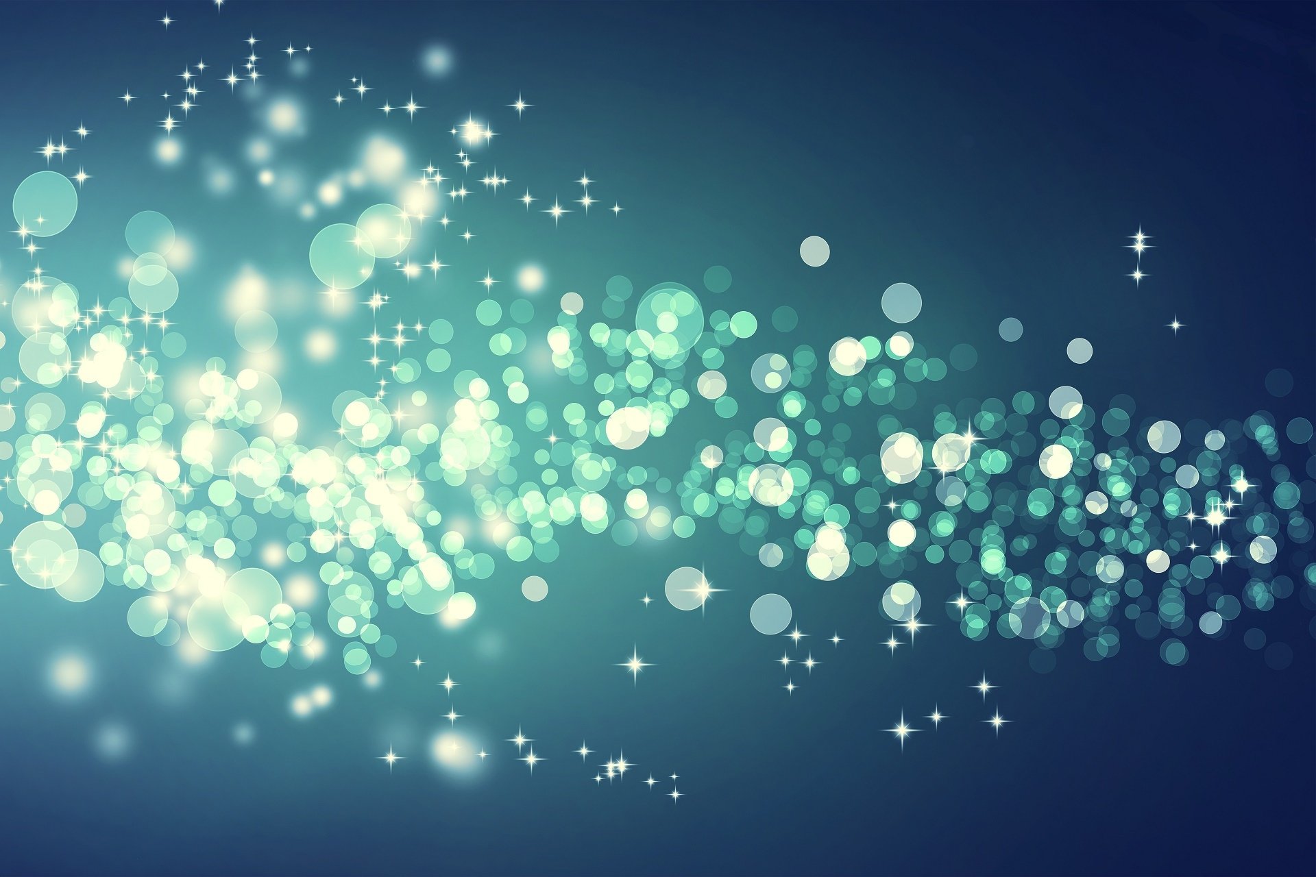 Artistic bokeh effect with glowing light orbs and sparkles on a dark blue background, rendered as an HD PC desktop wallpaper and background.