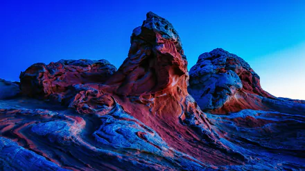 HD desktop wallpaper showcasing Arizona's desert landscape with striking red rock formations under a clear, vibrant blue sky.