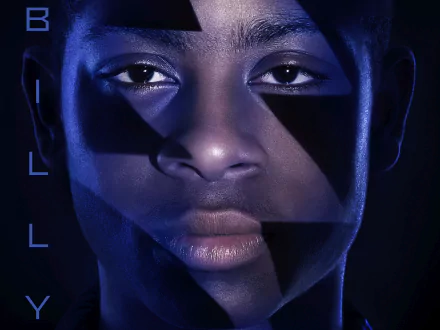 HD wallpaper featuring a close-up of a character from the movie Power Rangers (2017), showcasing a dramatic lighting effect with geometric shapes and an intense expression.