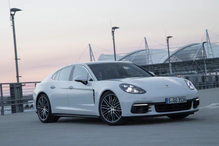 White Porsche Panamera 4S parked on a rooftop at dusk — high-resolution 4K Ultra HD PC desktop wallpaper and background featuring a sleek white Porsche Panamera.