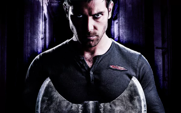 A dramatic HD wallpaper from the TV show Grimm, featuring a focused character holding a large axe, set against a dark, mysterious background.