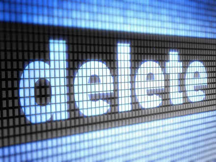 Close-up of the word delete displayed in large, illuminated letters on a pixelated screen, suited for a HD PC desktop wallpaper and background.
