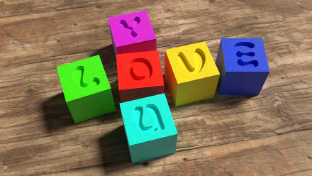 HD desktop wallpaper featuring colorful cubes with carved letters spelling LOVE on a wooden surface. Tags include colors, cube, artistic, love.