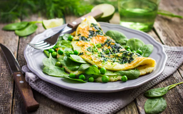 A vibrant still life of a spinach and pea omelette on a plate, captured in 4K Ultra HD detail, showcasing fresh greens and rustic wooden background.