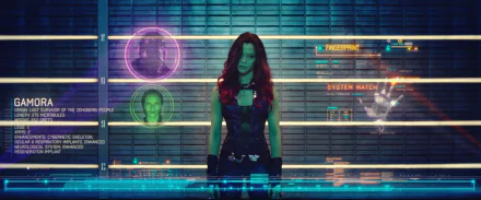 HD PC desktop wallpaper featuring Gamora from the movie Guardians of the Galaxy, standing confidently against a futuristic digital interface background.