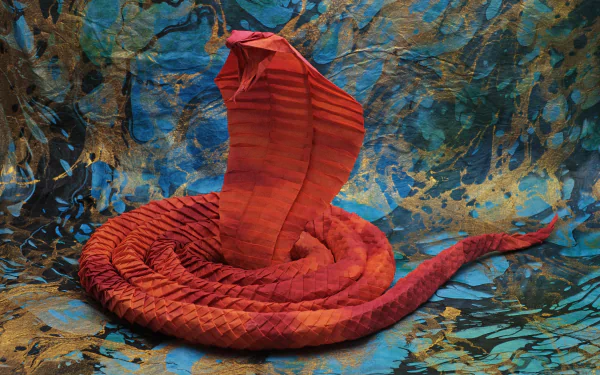 A detailed man-made origami snake in vibrant red, coiled with its hood expanded, set against a textured blue and brown background. 4K Ultra HD desktop wallpaper.