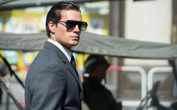 Napoleon Solo in a sharp suit and sunglasses from The Man from U.N.C.L.E., cinematic 4K Ultra HD PC desktop wallpaper.
