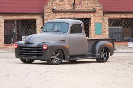 Matte-gray 1953 Chevrolet Truck hot rod chevrolet pickup vehicle parked before a brick warehouse — HD PC desktop wallpaper background