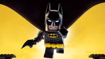 A vibrant HD wallpaper featuring a LEGO Batman figure from *The Lego Batman Movie*, showcasing the iconic hero in a dynamic pose against a striking yellow background.