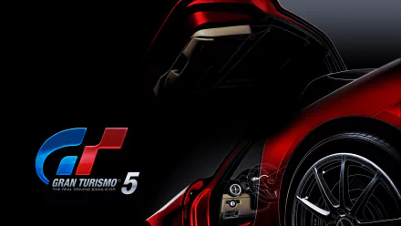 Video game Gran Turismo 5 HD PC desktop wallpaper: close-up of a glossy red sports car’s front end and wheel with the GT5 logo on a black backdrop.
