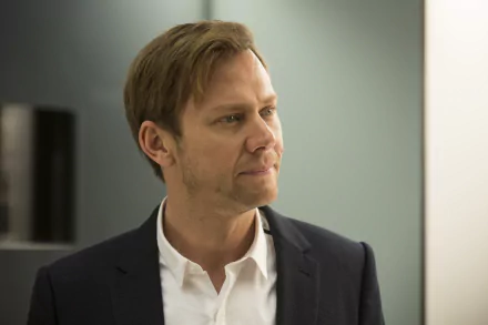 HD wallpaper featuring Jimmi Simpson as William from the TV show Westworld, capturing a moment of intensity with a contemplative expression against a minimalist background.
