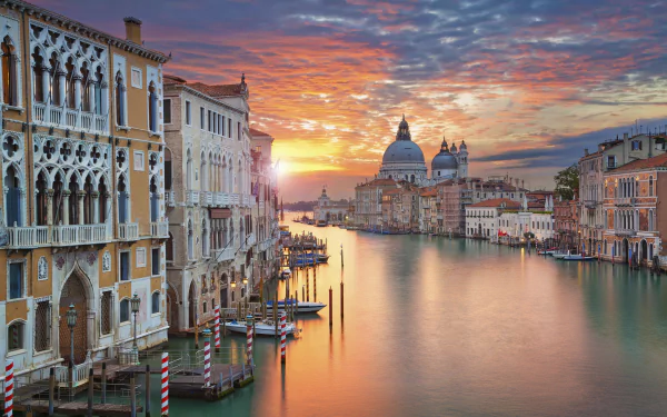 Sunset over Venice’s Grand Canal with historic buildings lining the water in Italy, captured in HD quality as a desktop wallpaper background.