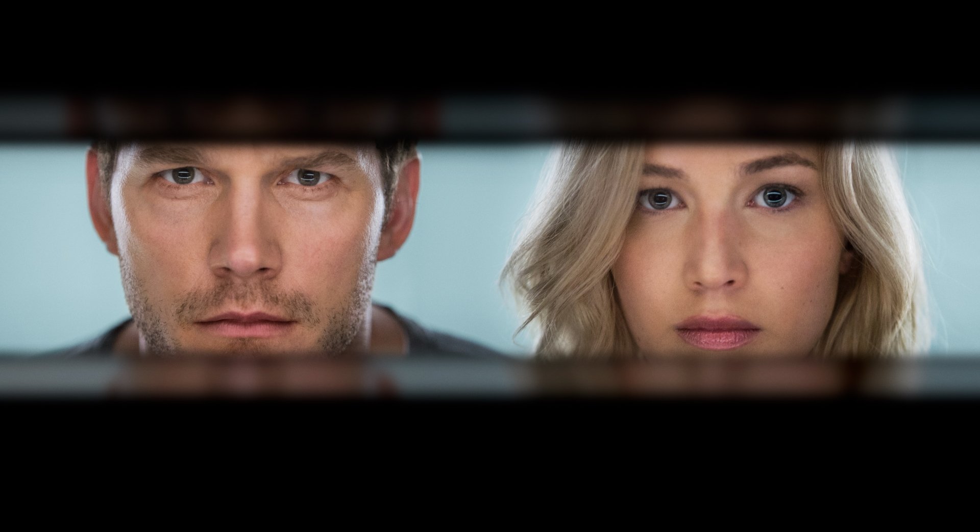 5K Ultra HD desktop wallpaper from the movie Passengers showing two lead actors' faces framed in a narrow horizontal porthole.