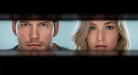 5K Ultra HD desktop wallpaper from the movie Passengers showing two lead actors' faces framed in a narrow horizontal porthole.