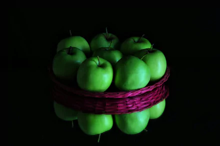A basket filled with green apples reflected on a dark surface, captured in sharp detail as a 4K Ultra HD desktop wallpaper background.
