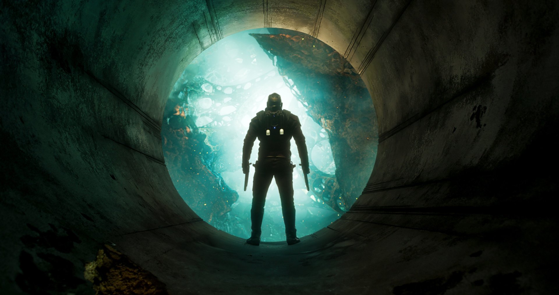Peter Quill, also known as Star-Lord, stands heroically in a circular tunnel, illuminated by vibrant light in this HD desktop wallpaper from Guardians of the Galaxy Vol. 2.