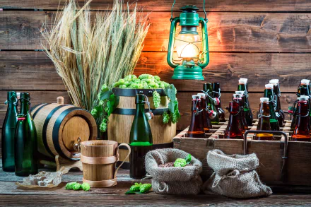 A 4K Ultra HD still life of beer bottles, a wooden barrel, wheat stalks, hop cones, burlap sacks, and a glowing lantern arranged on a rustic wooden surface.
