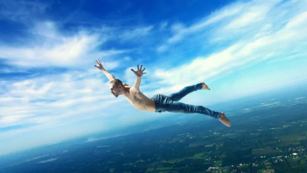 HD PC desktop wallpaper/background: a photoshop photography manipulation of a shirtless man falling through a bright blue sky above a patchwork countryside.