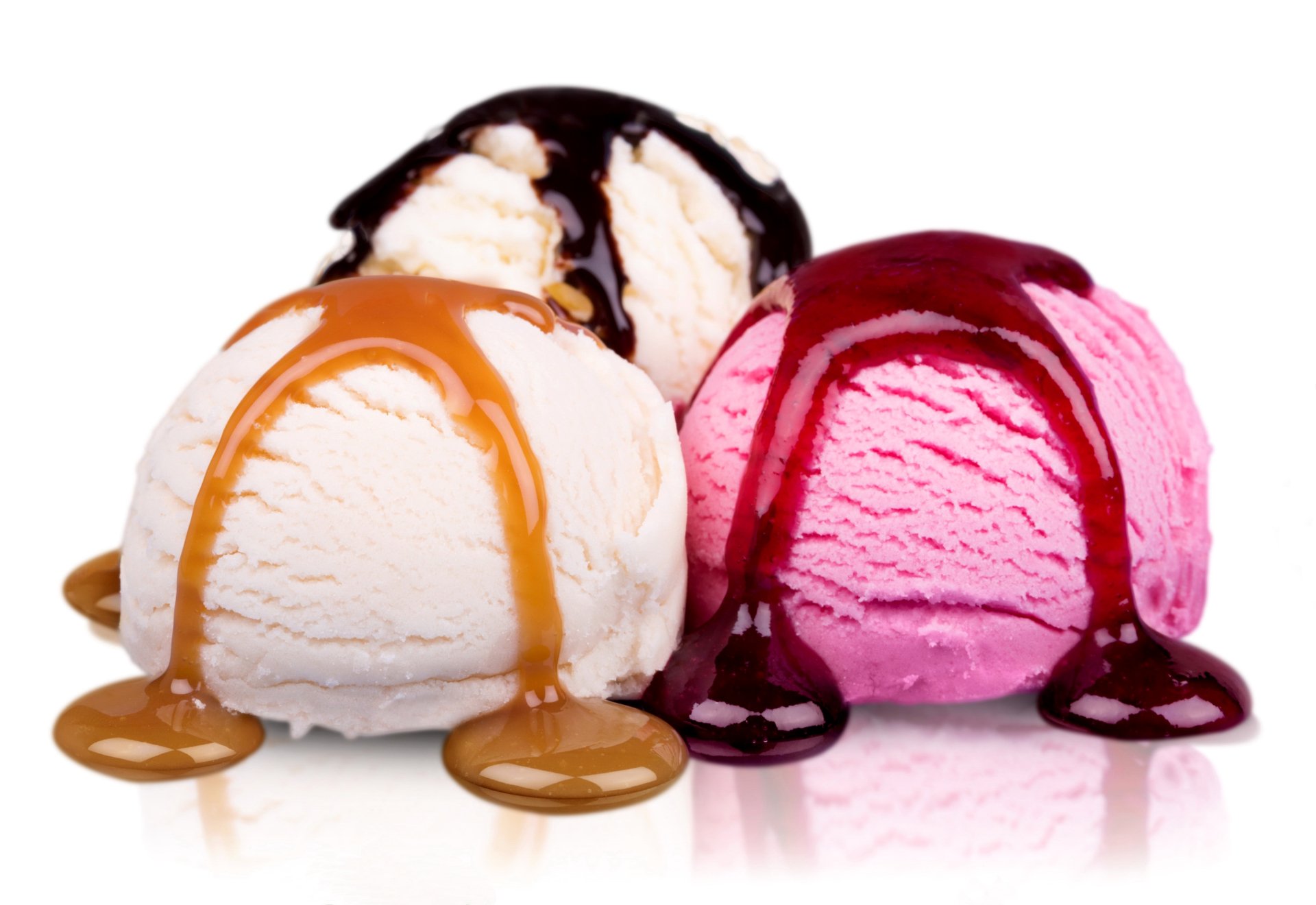 Three scoops of ice cream in white, pink, and cream colors, each topped with rich caramel, chocolate, and berry sauces, captured in stunning 4K Ultra HD quality.
