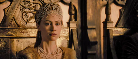 HD desktop wallpaper of Sarah Gadon in Dracula Untold, portraying a regal character adorned in a jeweled headpiece and intricate jewelry.